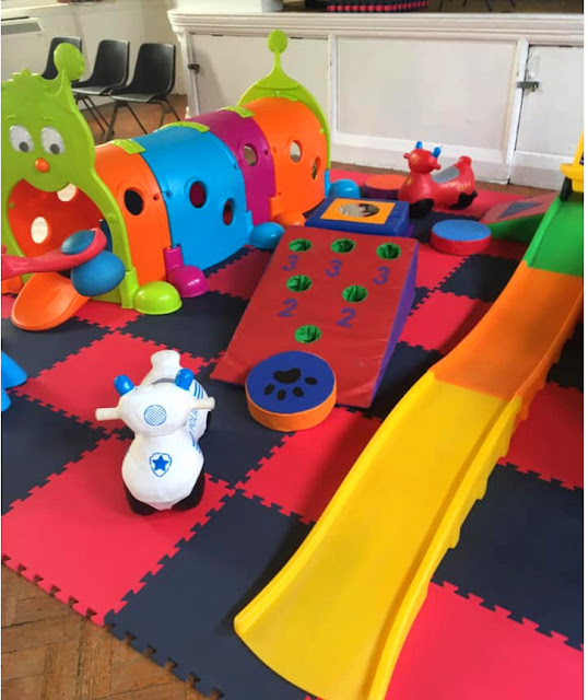 image shows a selection of soft play equipment set up for a party