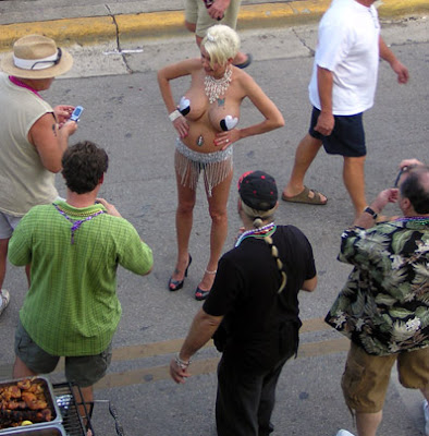 Skimpy and sexy costume draws a crowd on Duval Street during Fantasy Fest 2007