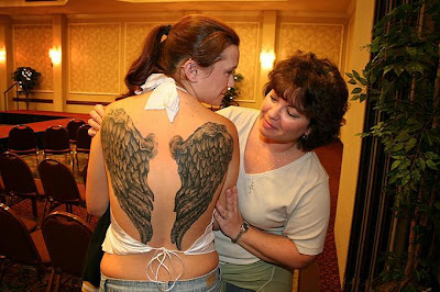 Tattooed Women Wings Tattoo on Back Body