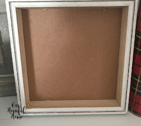 thrifted white frame shadow box