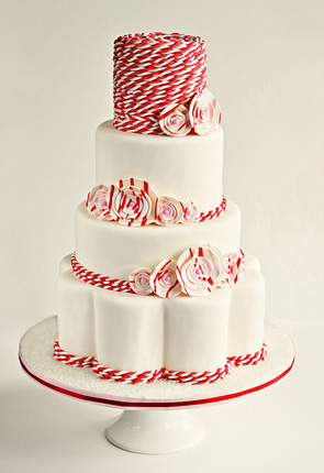 Amazing wedding cake in red and white decorated with peppermint candy