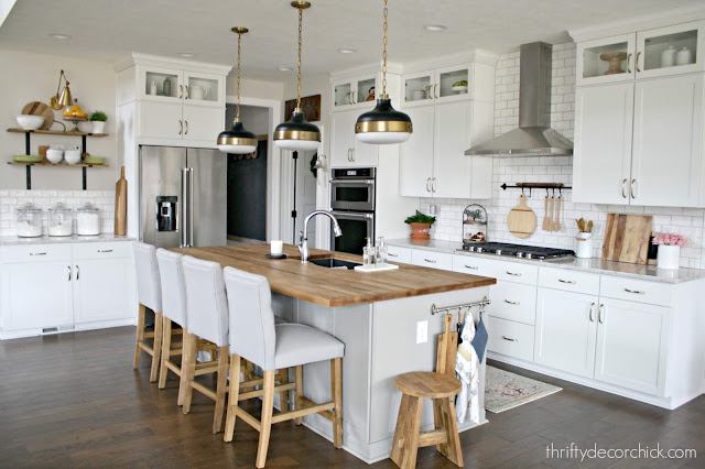 Warming up white kitchen with wood tones
