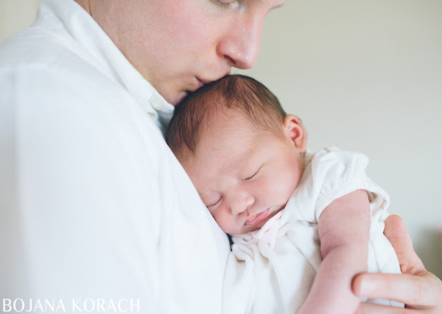 san francisco newborn photographer captures baby girl sleeping in father's arms