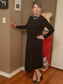 Black midi-skirt-black-cashmere sweater-long-black-coat-high-heel-shoes