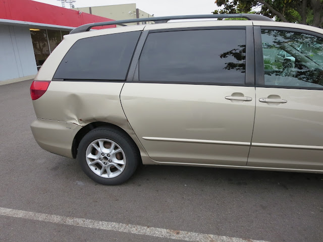 Big dents in side of Toyota Sienna before collision repair.