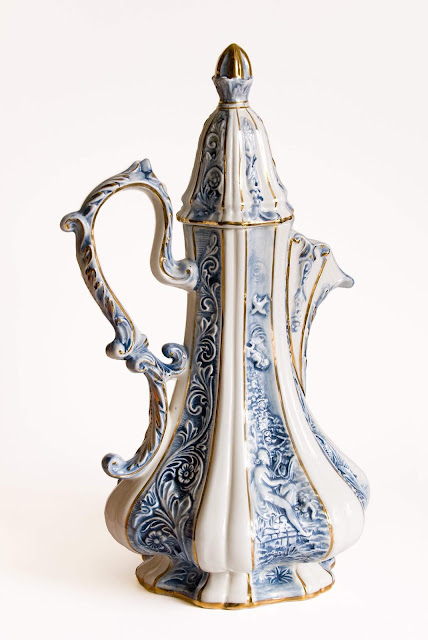 A very tall blue and waterjug from Capodimonte.