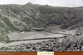 1953 black and white photo of Oku Village,river,mountains