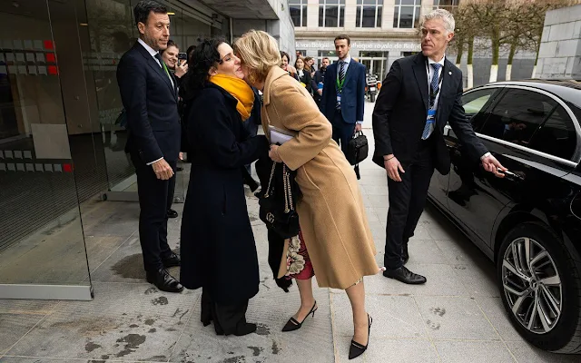 Princess Astrid wore a multicolor foulard print long sleeve crepe de chine dress by Valentino. Gucci leather bag