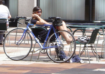 woman lounging with her blue bike