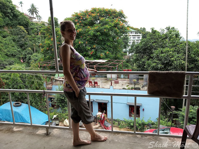 Kathi posing with her belly in Guwahati at one of our stays