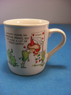 http://www.bargaincart.ecrater.com/p/18961168/hallmark-mug-have-to-kiss-frogs#