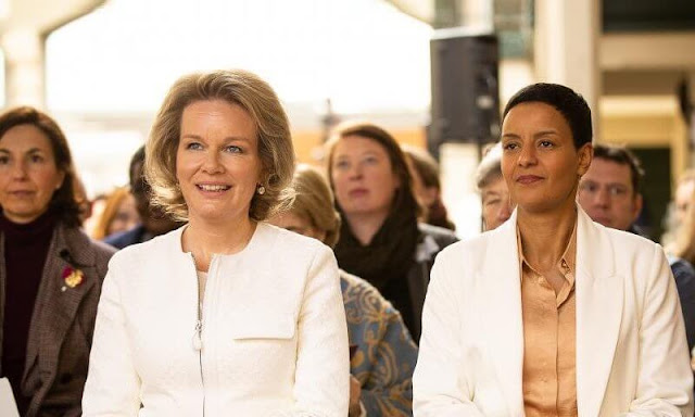 Queen Mathilde and Minister Meryame Kitir attended an event of The Shift. Queen Mathilde wore a white jacket by Armani