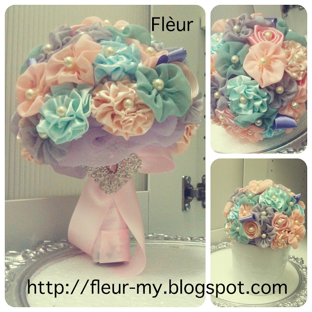 Pastel Rainbow Hand Bouquet by Fleur. Pastel Mint, Grey, Pink, Peach and Purple.