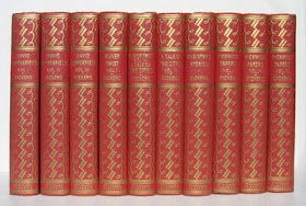 matching set of Charles Dickens books in red covers with gold decoration