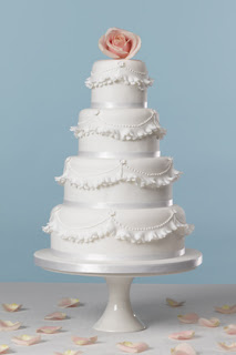 4 Tier White Wedding Cake with Ruffles and Pink Rose