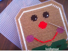 Decorate your kitchen or Christmas party with this free plastic canvas pattern for your Dollar Store napkin holder.  Easily add a bit of Gingerbread whimsy with this Gingerbread man pattern that slides over your holder and brightens up your home.