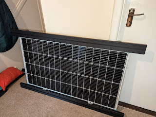 Renogy solar panel mounted to Alu-Cab load bars