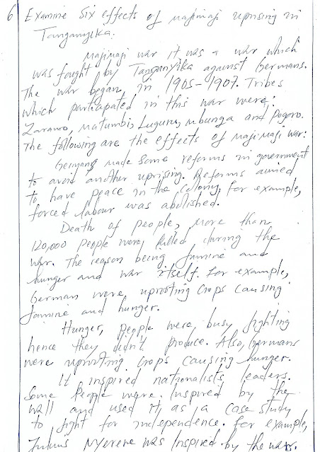 A paper written history essay using hand.