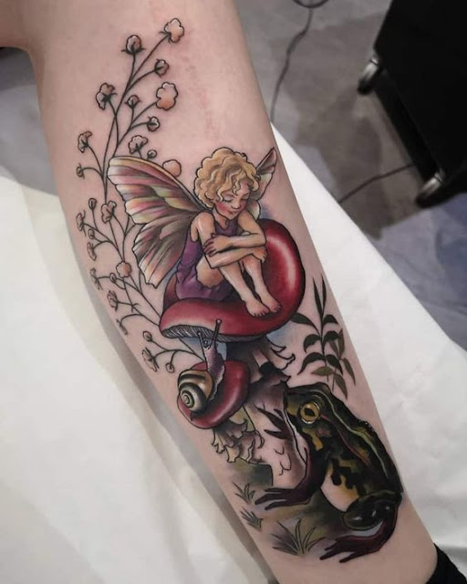 Fairy-on-Mushroom-with-Snail-and-Frog-Tattoo