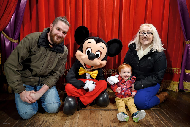 Toddler and Mum and Dad meeting Mickey Mouse