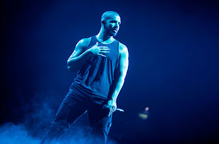 Image of Drake performing Nice For What and God's Plan live on stage