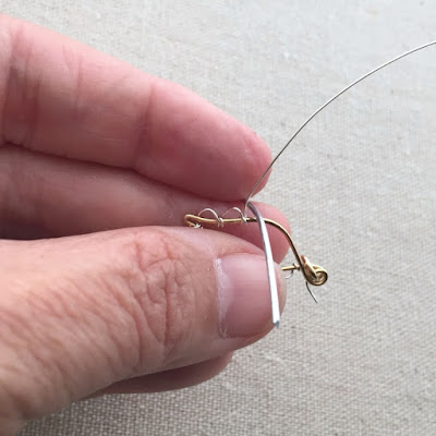 Learn to make this wire leaf with scallop edge - from a free tutorial at Lisa Yang's Jewelry Blog