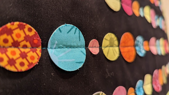 3-D applique circles made into an abacus quilt
