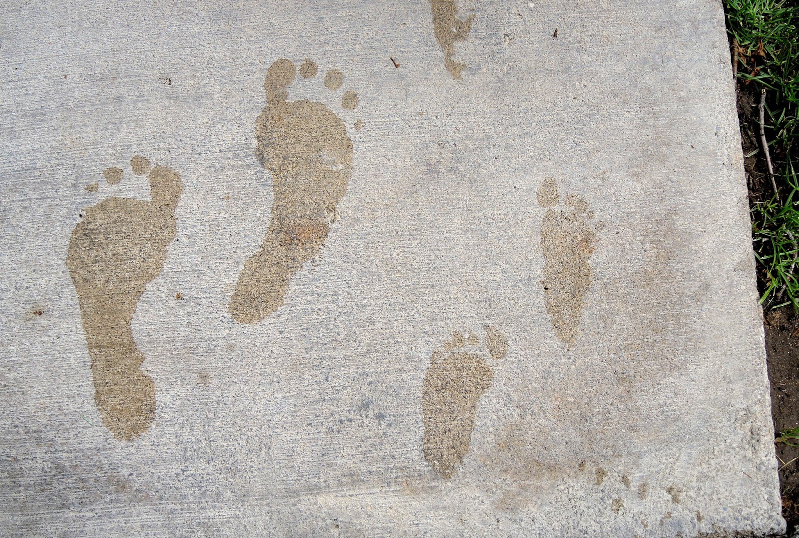 Grandma and Carter barefoot footprints.