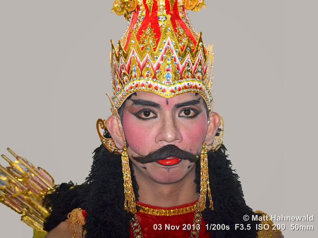 photo, portrait, Facing the World, © Matt Hahnewald, artist, 50 mm prime lens, Nikon DSLR D3100, fake moustache, headgear, Indonesia, wayang wong, Surakarta, Sriwedari Theatre, Javanese dance, Mahabharata, wayang orang, Ramayana, dancer, performer, posing