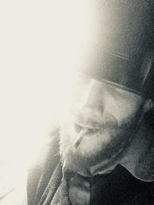 Oregonleatherboy grinning with joint in mouth hypnosmoke black and white sexual smoke ganja magic trance photograph for adults over 18 years 10/10