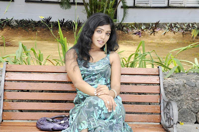 Rima kallingal Sitting on a Bench