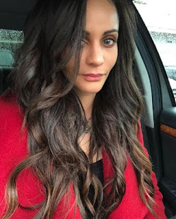 Persia White clicking a selfie while sitting inside the car