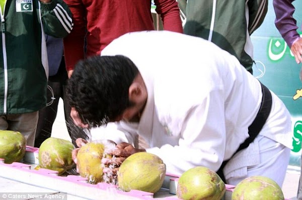 Pakistani Man Makes New Record After Smashing 43 Coconuts With His Head In 60 Seconds (Photos)