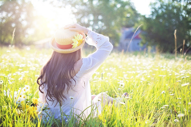 woman in field of flowers