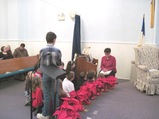 Laurel reading Scripture to the Mt. Zion church family