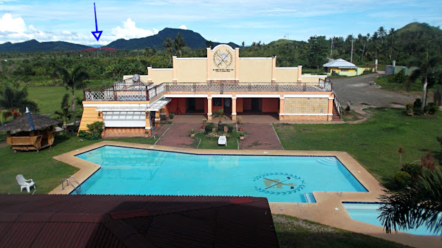 swimming pool of san juanico park golf and country club with san juanico bridge in the background
