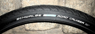 Side view of Schwalbe Road Cruiser 26x1.75 bicycle tire showing manufacturer logos and text