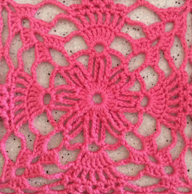 Close up view of the crochet lace motif square