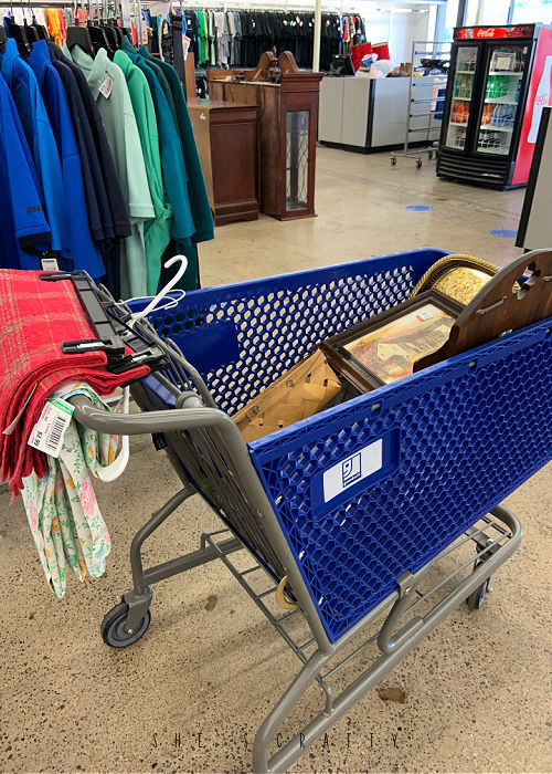 Cart full of thrifted items at Goodwill.