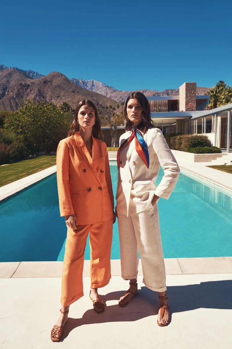 Models Julia Van Os and Regitze Christensen pose poolside for Piombo summer 2022 campaign