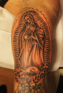 Santa Muerte tattoo: Santa Muerte portrayed as a skeletal version of the Virgin of Guadalupe