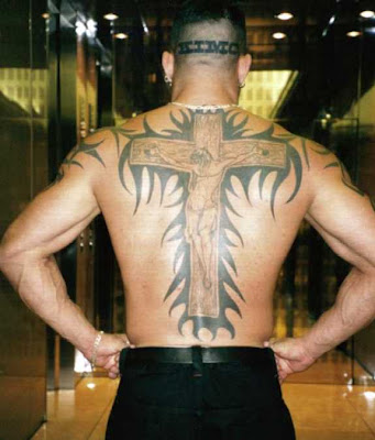 He also had a religious tattoo that would put Kanye's bling to shame,