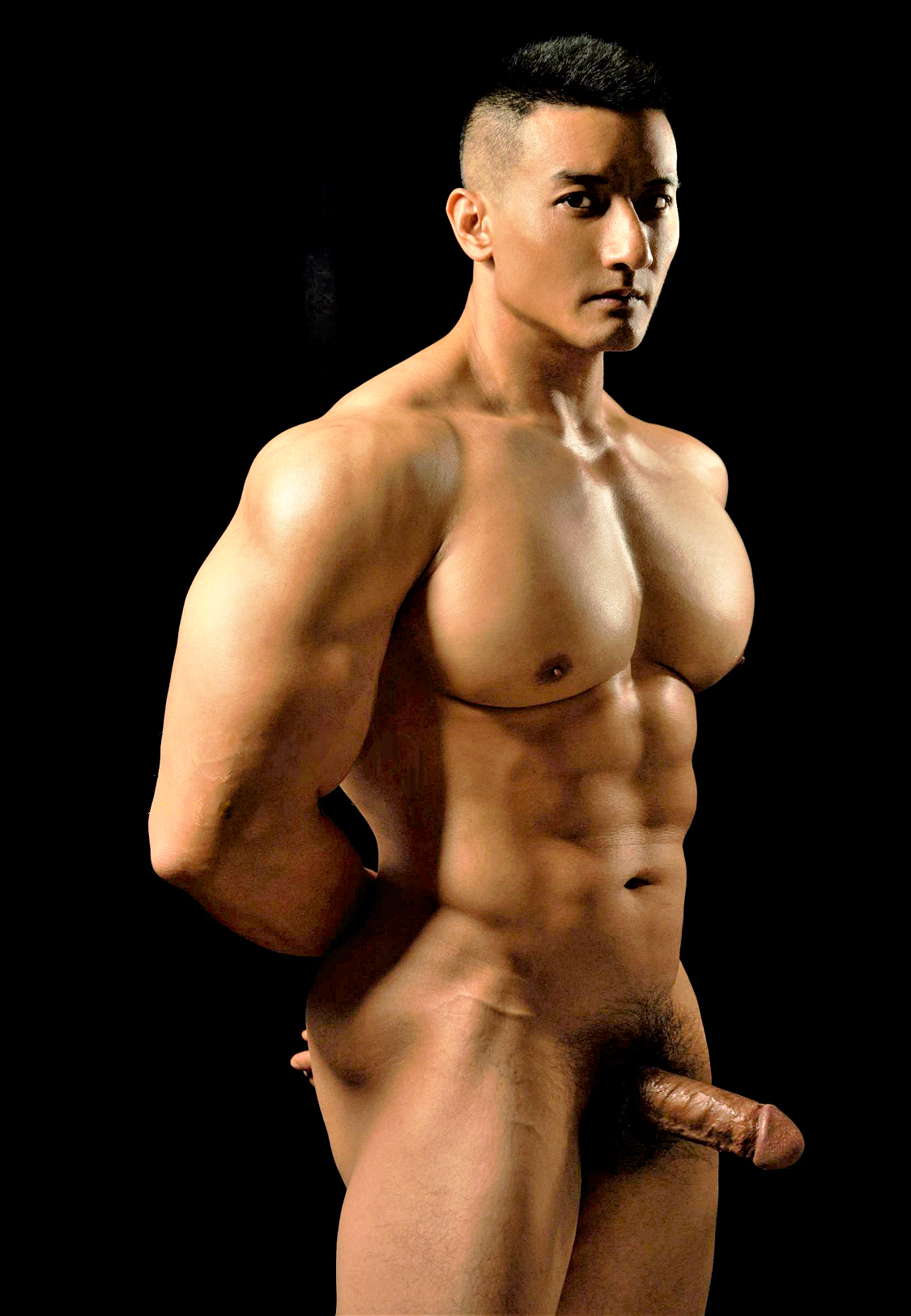 Nude bodybuilder posing