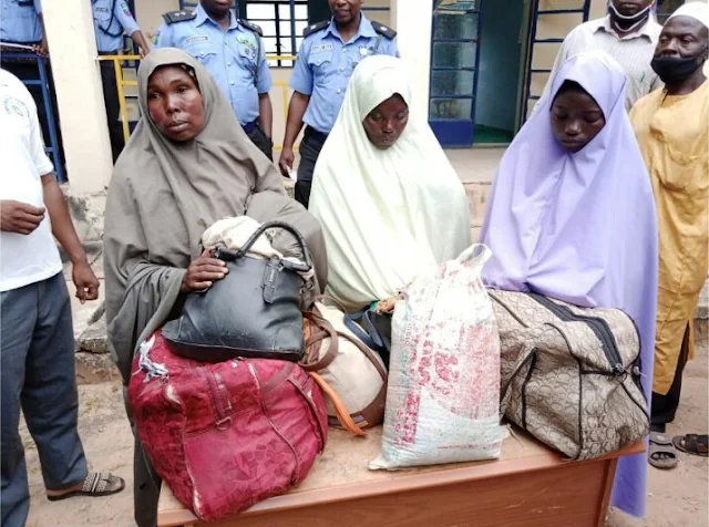 Alt: = "photo of three women caught with petrol in their bags which they are taking to bandits