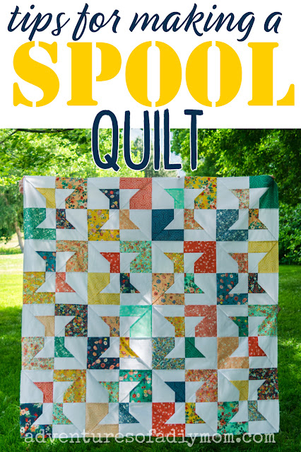 spool quilt with text overlay
