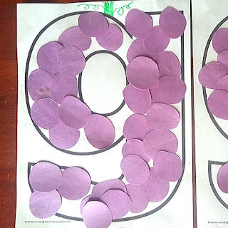 Use purple circles and the letter outline to create a grape craft with the letter G.