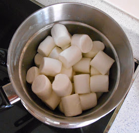 Put the marshmallows in the double boiler with 1 tablespoon of water