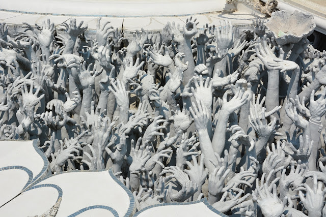 White Temple Chiang Rai hands