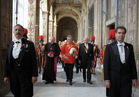Archbishop James Harvey escorts the new Grand Master of the Knights of Malta, Matthew Festing of Britain, before his meeting with Pope Benedict XVI at the Vatican