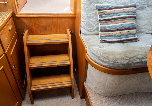 Photo of the steps from Ravensdale's galley up into the saloon and the dinette seat she now jumps from